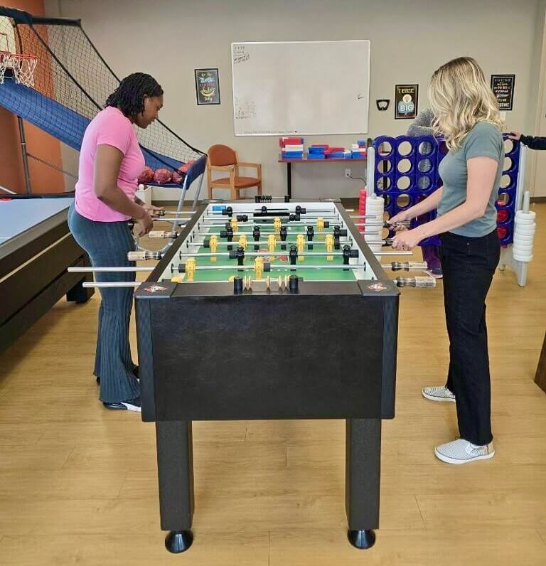 904051608-foozeball Women playing foosball