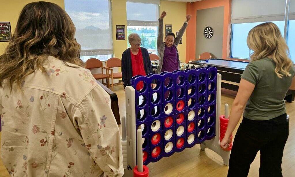 904051613-connect-4 Adults playing Connect Four