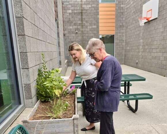 904051614-imagejpeg2-1 Women gardening in an outdoor courtyard